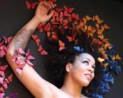 Maya Azucena with butterflies over her head