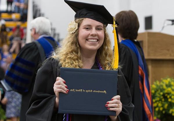graduate with her diploma